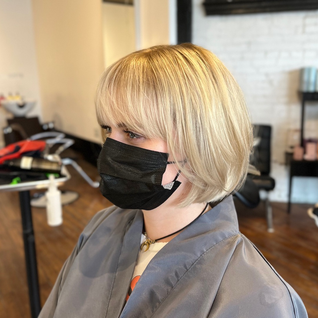 9. French-Inspired Blonde Bob with Fringe - Medium Bob Haircuts