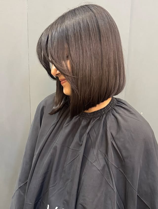 22. Sleek Espresso Angled Bob with Side Fringe - Medium Bob Haircuts