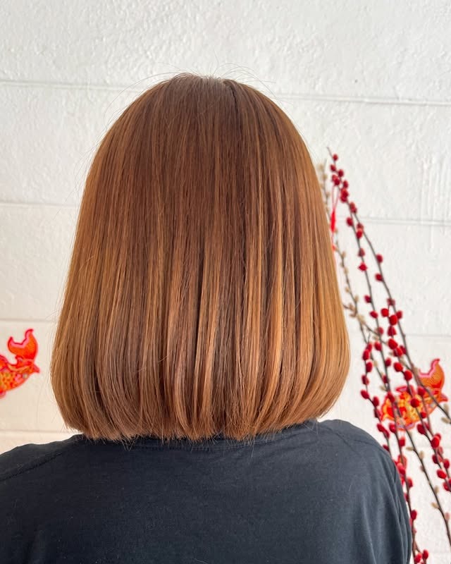 8. Sleek Golden Brown Blunt Bob - Golden Brown Hair Color