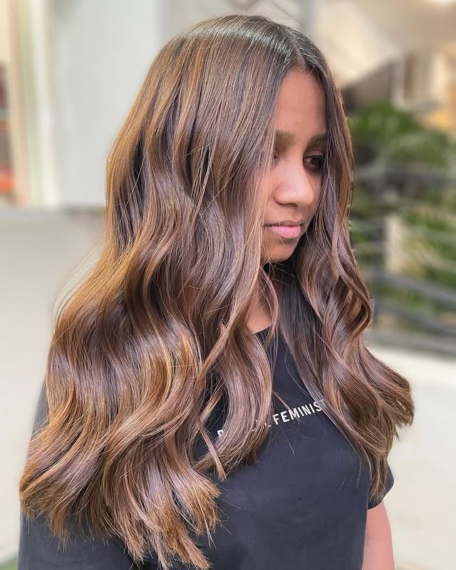 13. Ash-Infused Golden Brown Balayage Waves - Golden Brown Hair Color