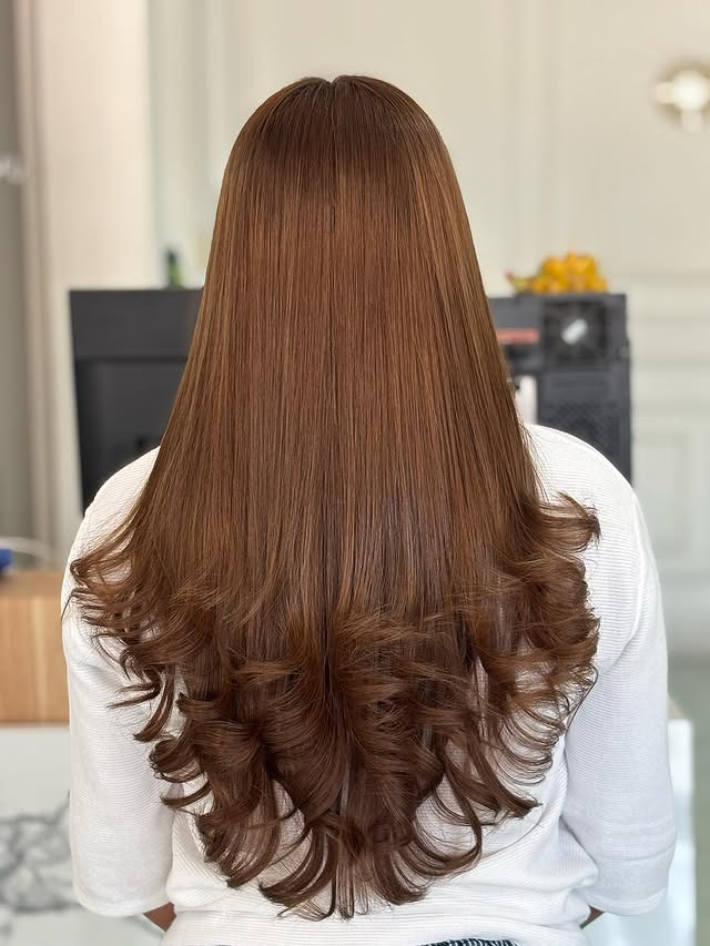 20. Golden Brown Long Layers with Curled Ends - Golden Brown Hair Color