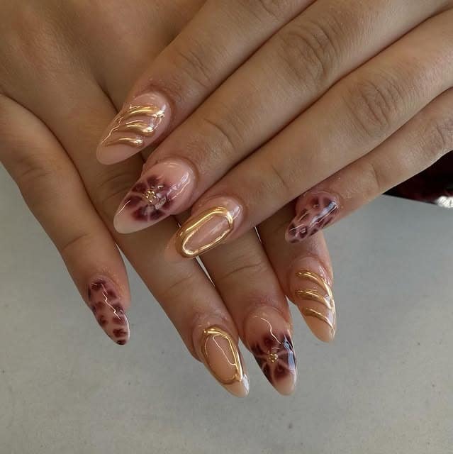 17. Nude and Burgundy Almond Nails with Gold Chrome Accents - burgundy and gold nail ideas