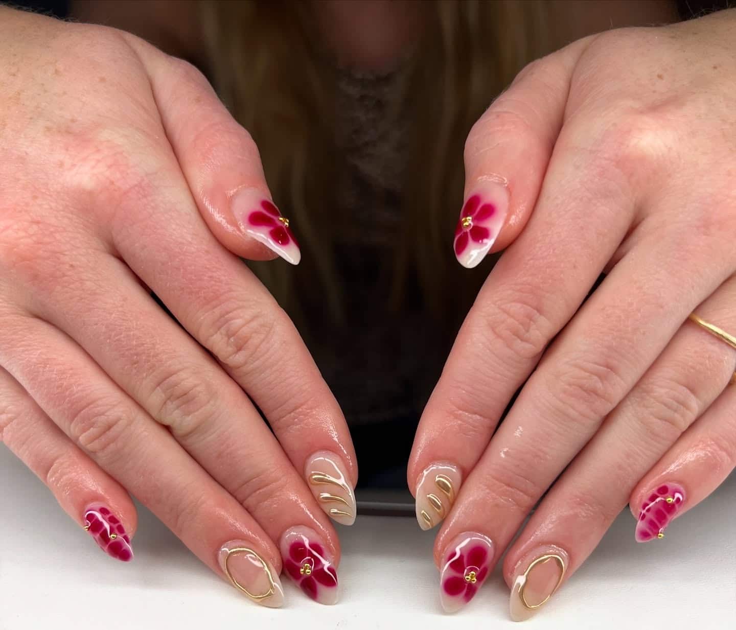 21. Blush Almond Nails with Burgundy Floral Art and Gold Outline Accents - burgundy and gold nail ideas