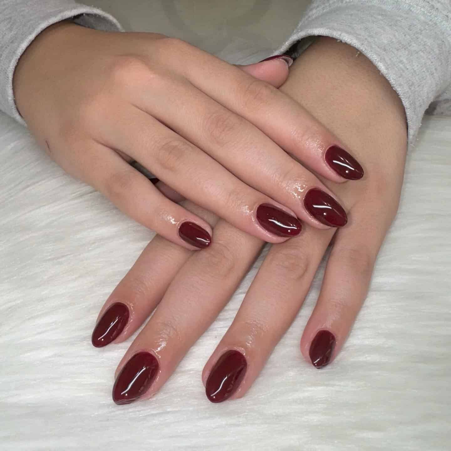 3. Short Wine Red Oval Nails - burgundy fall nail ideas