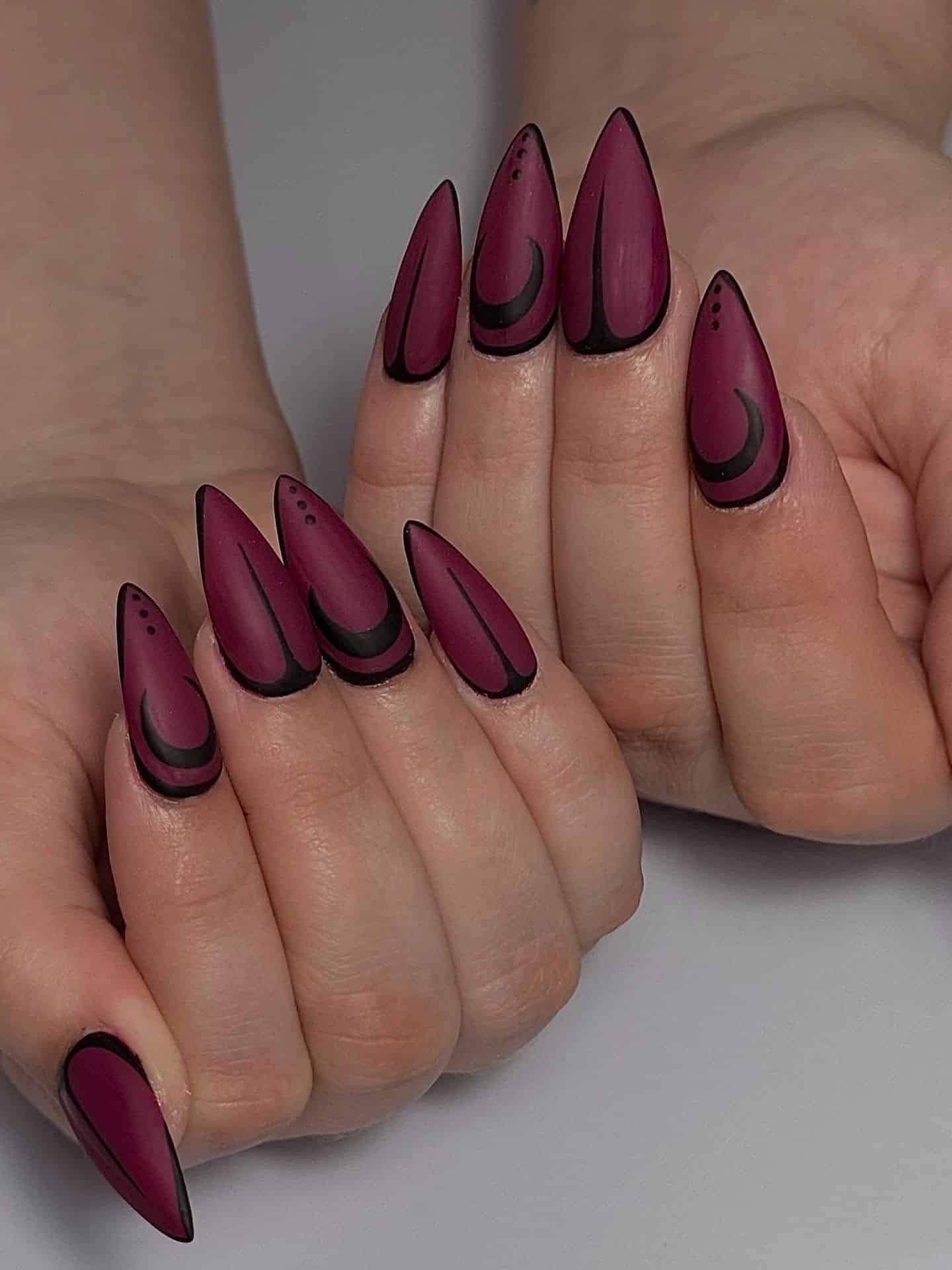 6. Matte Plum Stiletto Nails with Black Detailing - burgundy fall nail ideas
