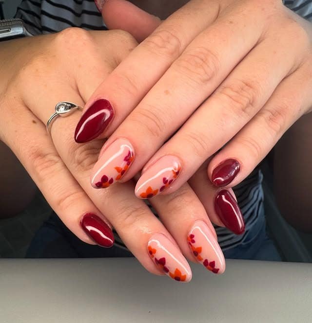 16. Burgundy Almond Nails with Autumn Leaf Accents - burgundy fall nail ideas