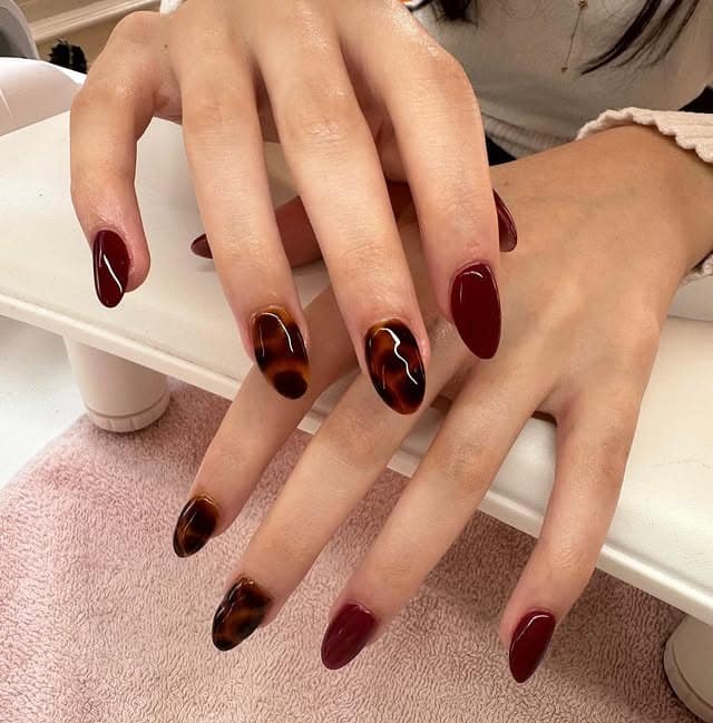 20. Burgundy and Tortoiseshell Almond Nails - burgundy fall nail ideas