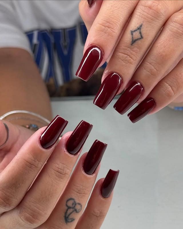 21. Glossy Deep Burgundy Coffin Nails - burgundy fall nail ideas