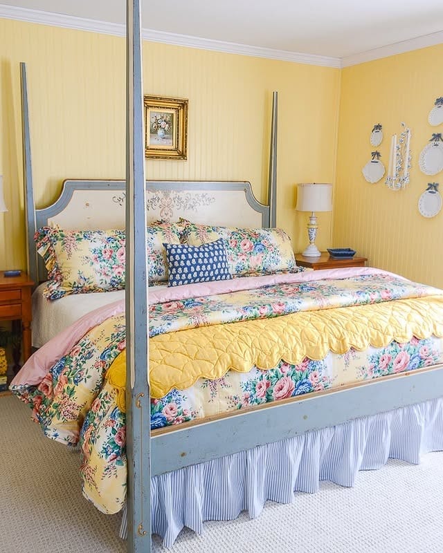 6. Cottage-Inspired Floral Bedroom in Pastel Yellow - yellow bedroom ideas