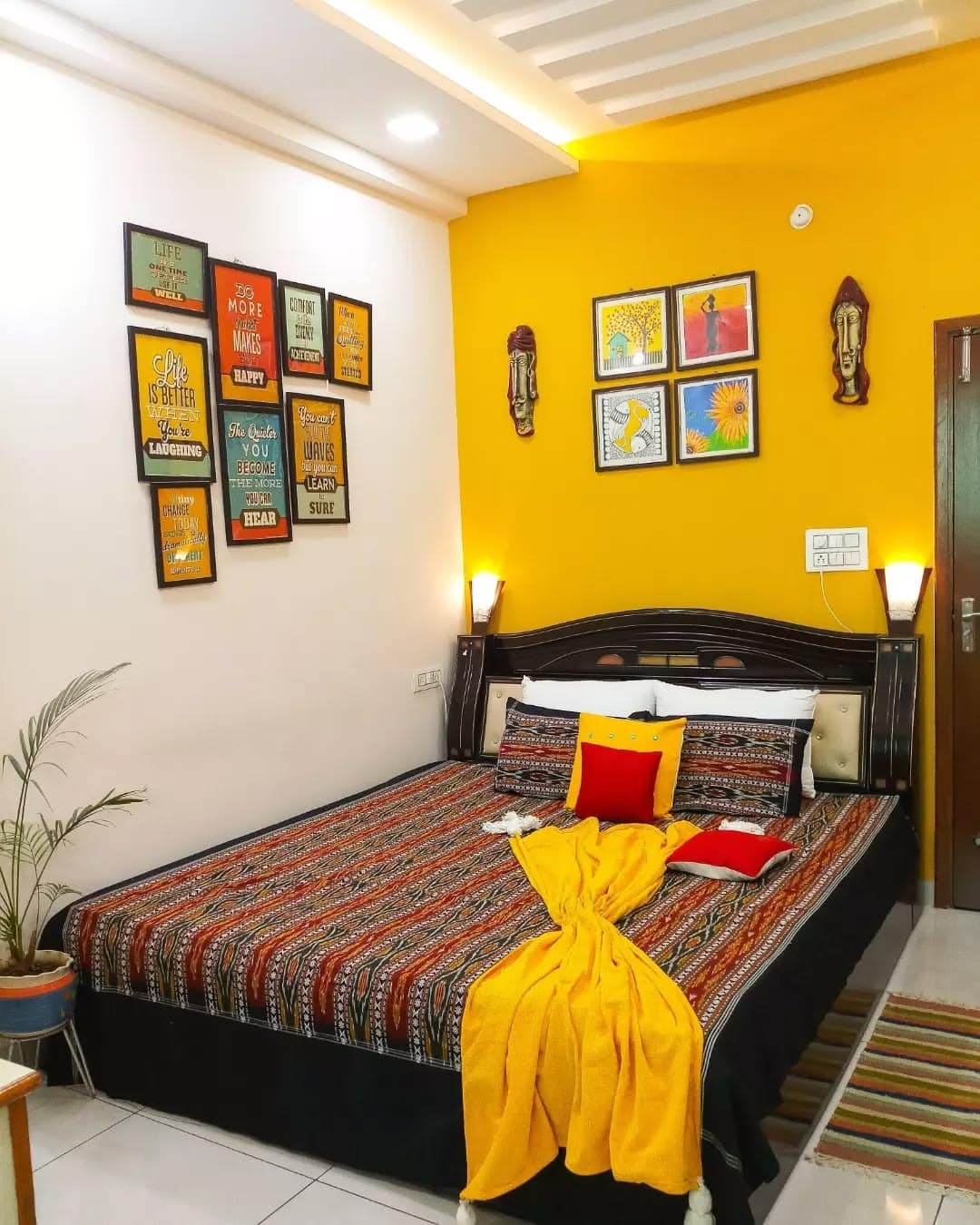 8. Graphic Accent Bedroom in Vibrant Yellow and White - yellow bedroom ideas