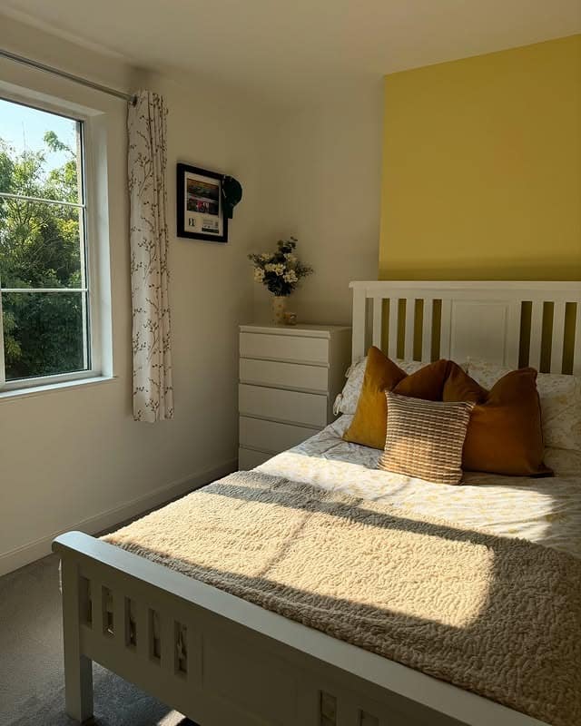 18. Soft Accent Bedroom in Pale Primrose Yellow - yellow bedroom ideas