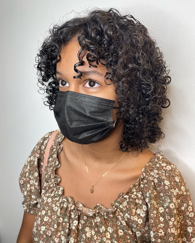 7. Short Curly Bob with Natural Black Shine - Curly Bob Hairstyles