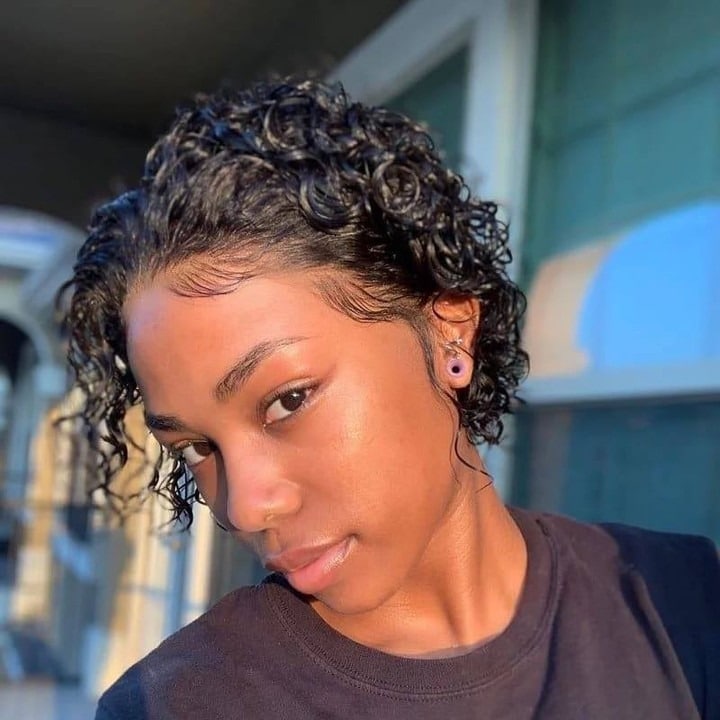 14. Jet Black Cropped Curly Bob with Sleek Edges - Curly Bob Hairstyles