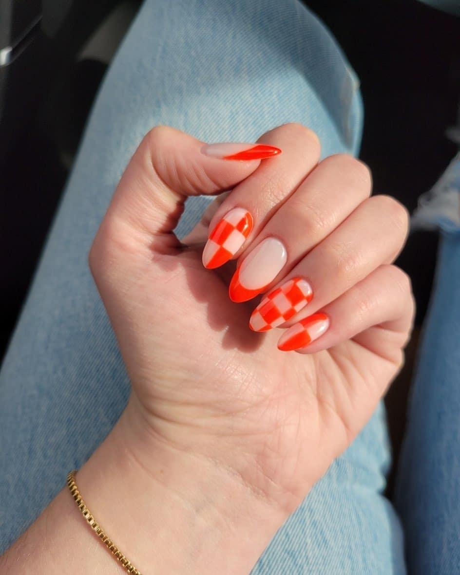 10. Neon Orange Checkered Almond - checkers nail ideas