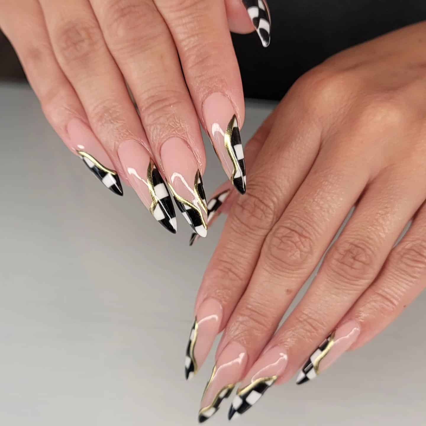18. Black & White Checker French with Gold Waves - checkers nail ideas