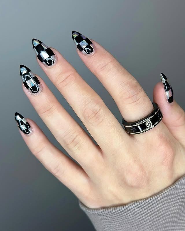 19. Iridescent Black Checker Stiletto - checkers nail ideas