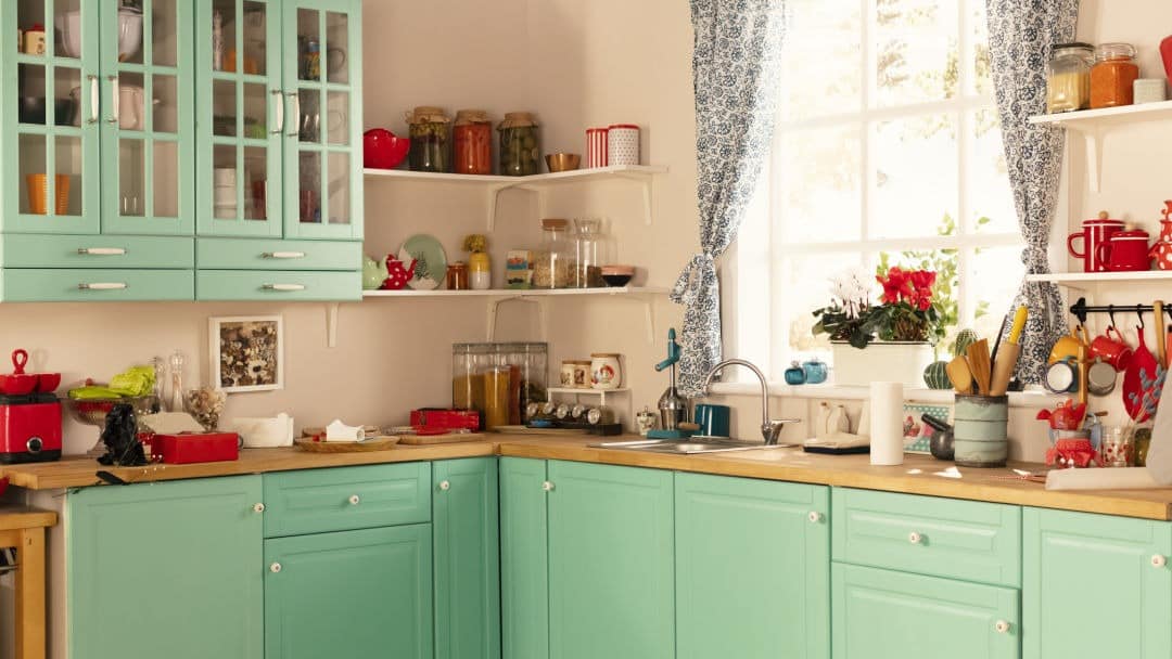 21. Retro Mint Green Kitchen with Cherry Red Accents - vintage kitchen ideas