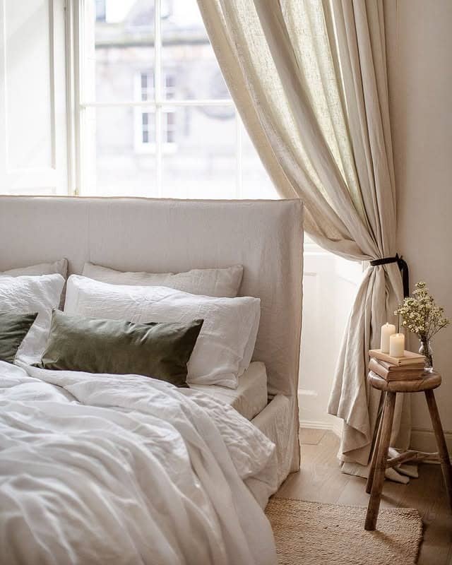 2. Soft Linen Off-White Bedroom with Classic Window Drapery - off white bedroom ideas