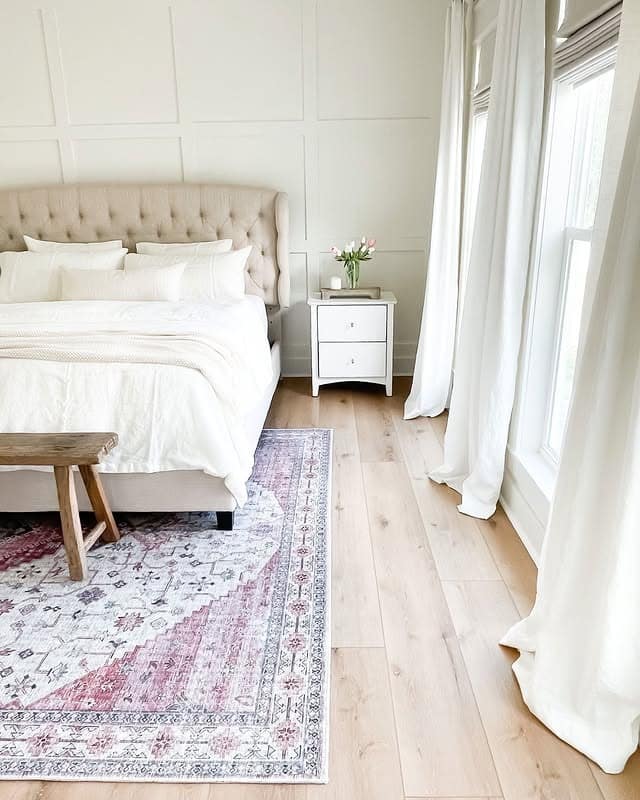 4. Traditional Off-White Bedroom with Panelled Walls and Blush Rug - off white bedroom ideas