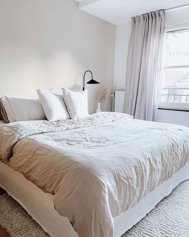 8. Contemporary Off-White Bedroom with Soft Taupe Drapery - off white bedroom ideas