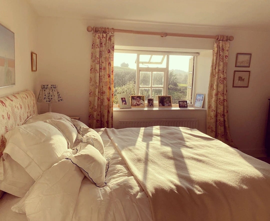 15. Cottage-Style Off-White Bedroom with Floral Accents - off white bedroom ideas