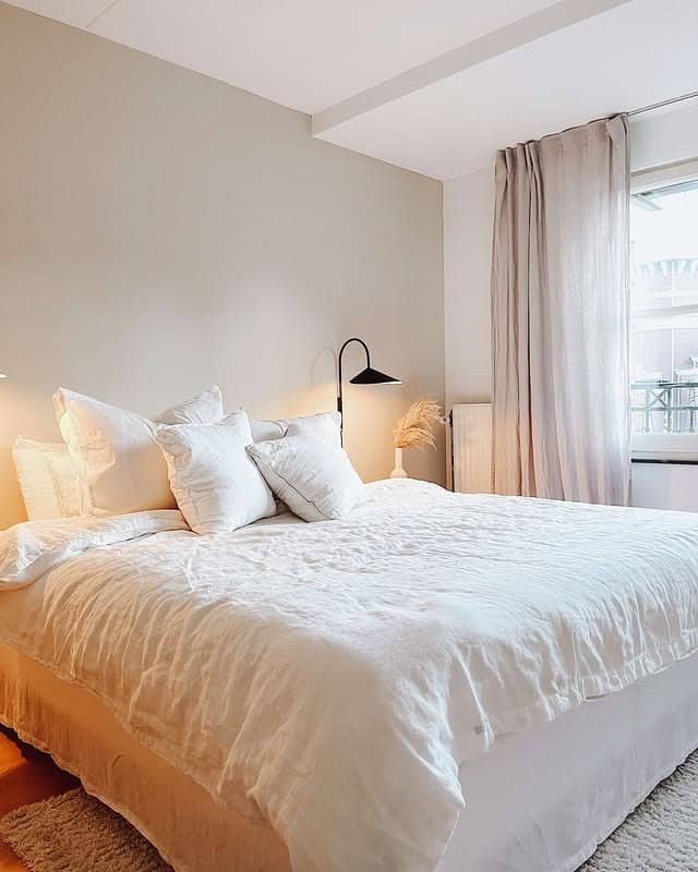 17. Airy Off-White Bedroom with Minimal Black Accents - off white bedroom ideas