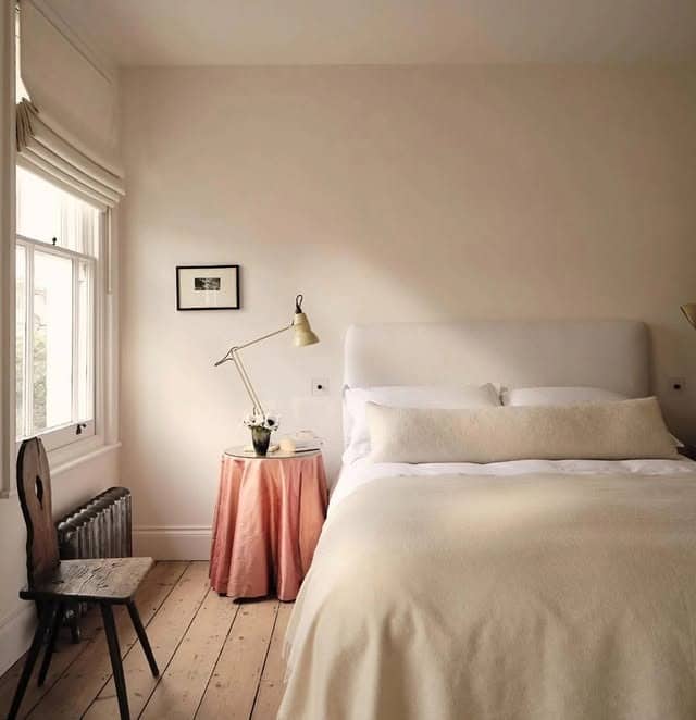 22. Soft Off-White Bedroom with Blush and Natural Wood Accents - off white bedroom ideas