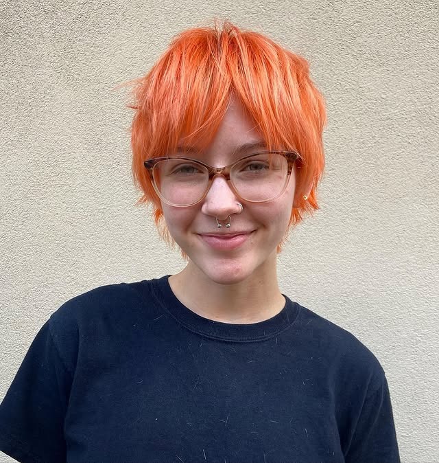 9. Vibrant Orange Shag Pixie with Soft Fringe - Shaggy Pixie Haircut