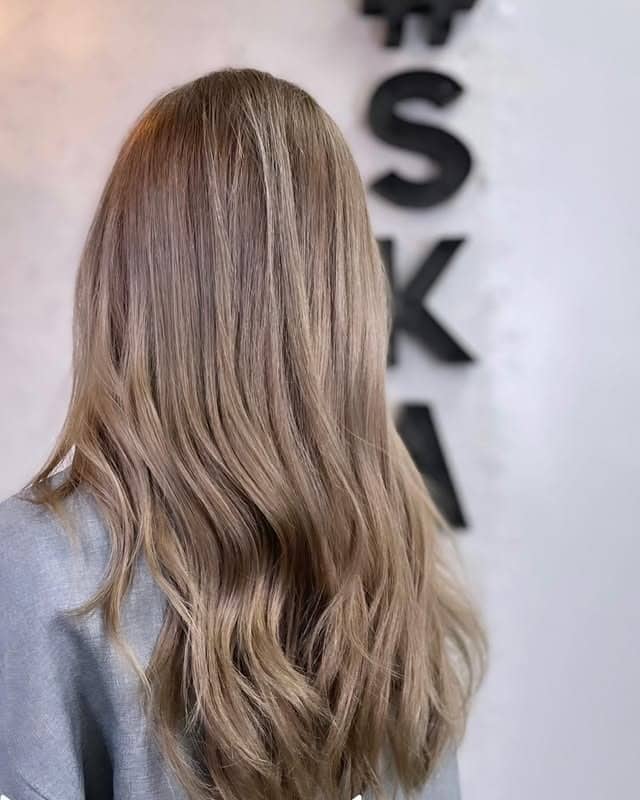 2. Smooth Sandy Light Ash Brown with Seamless Layers - Light Ash Brown Hair Color