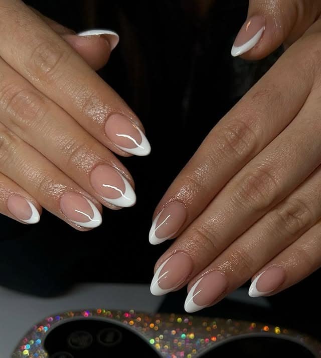 3. Classic Nude Almond French Tips - classy almond nail ideas