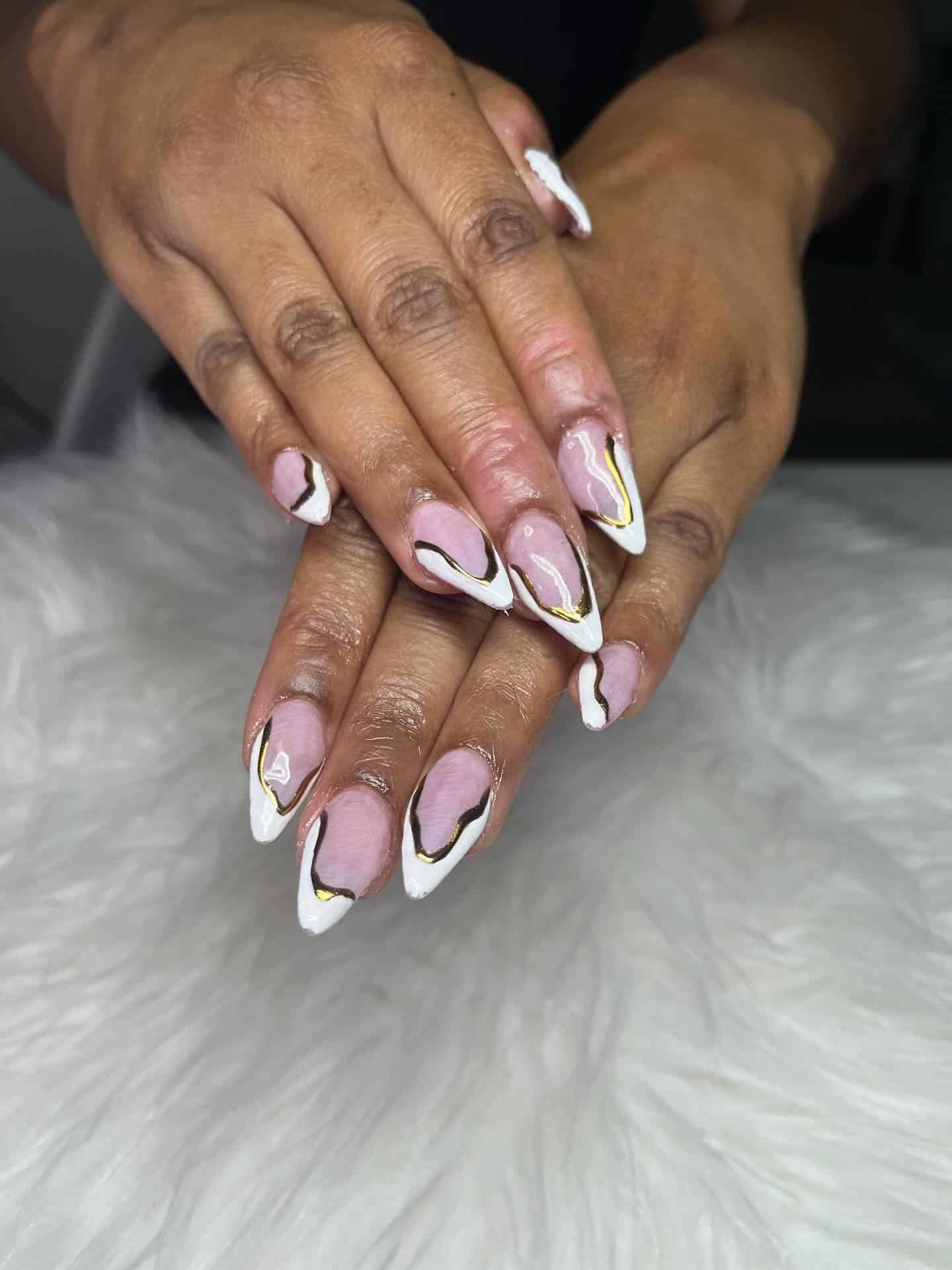 6. Pink Marble Almond French with Gold Accents - classy almond nail ideas