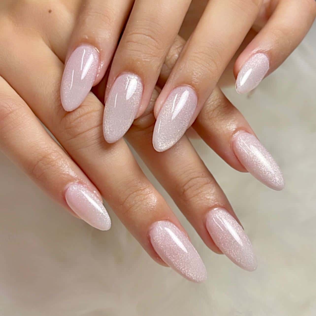 7. Shimmering Baby Pink Almond Nails - classy almond nail ideas