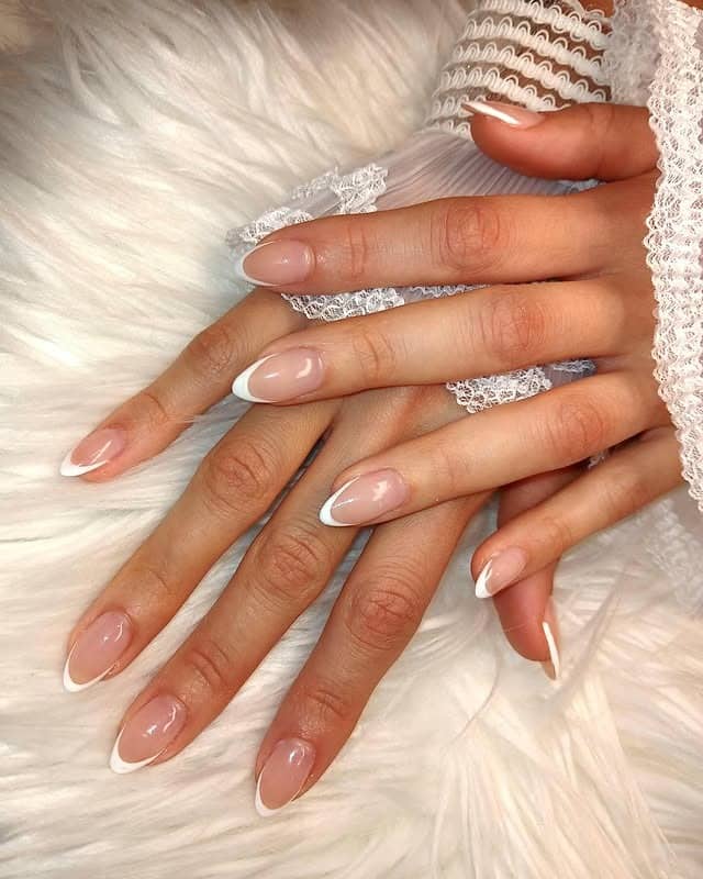 13. Milky Pink Almond Classic French - classy almond nail ideas