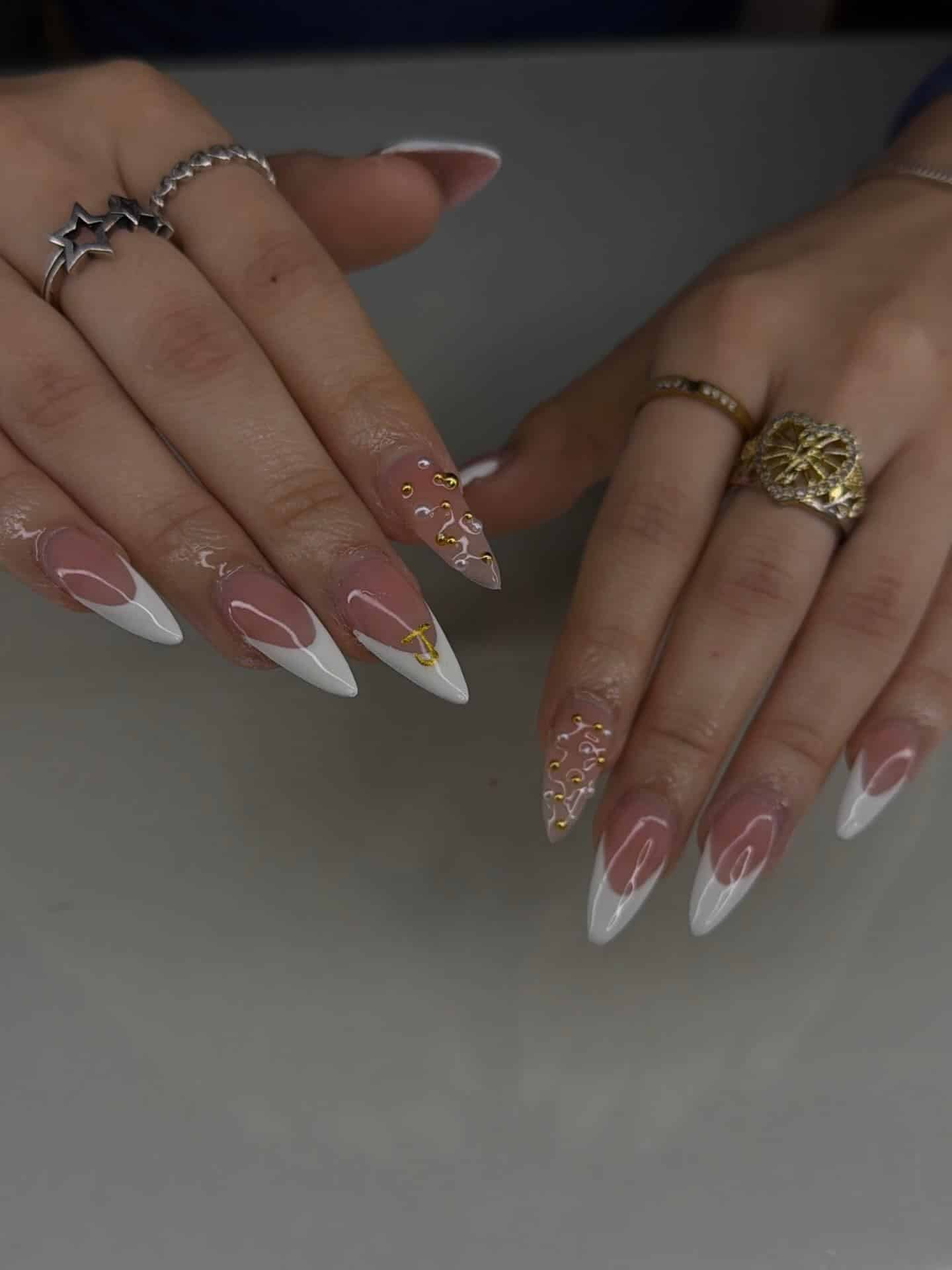 18. Rose Nude Almond French with Gold Stud Accents - classy almond nail ideas