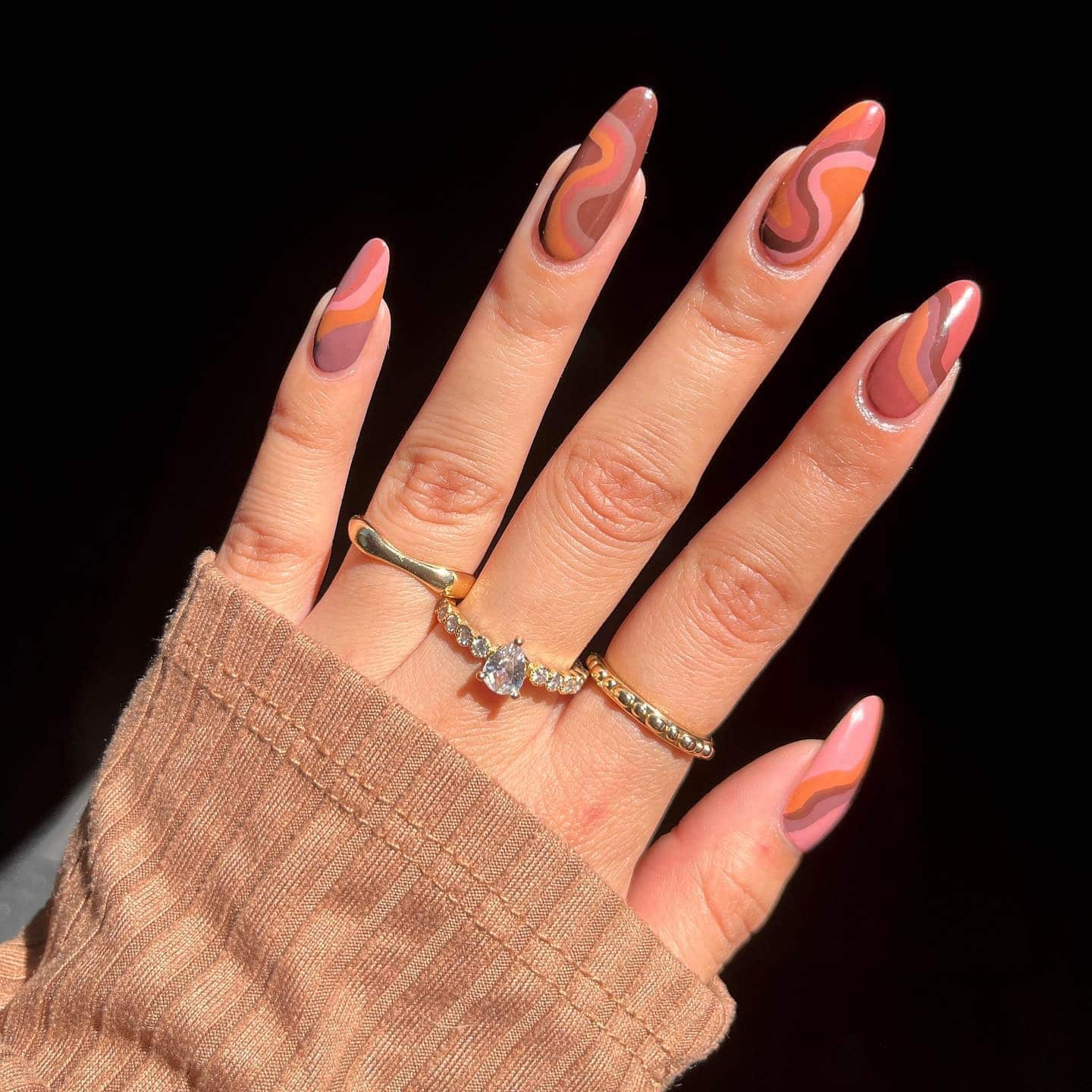 5. Retro Caramel Swirl Almond Nails - coffee color nail ideas