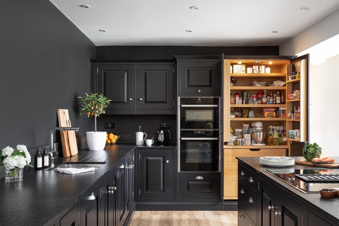 3. Charcoal Black Pantry Wall with Integrated Storage - black kitchen cabinets ideas