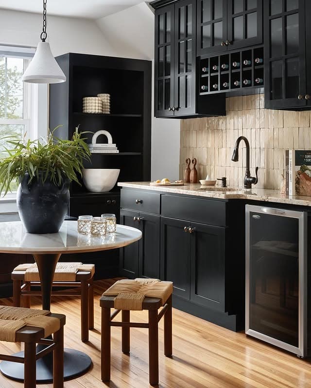 10. Traditional Black Cabinetry with Brass Accents and Light Wood Floors - black kitchen cabinets ideas