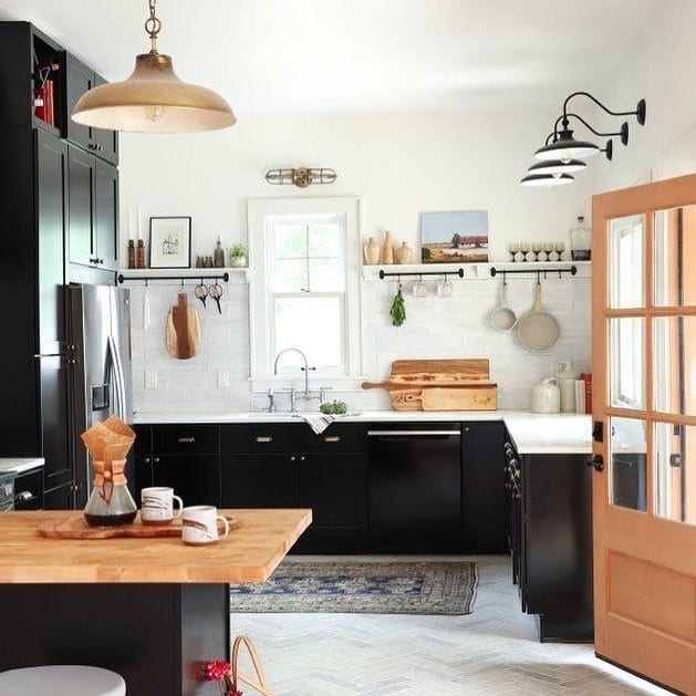 16. Farmhouse Black Kitchen with White Subway Tile - black kitchen cabinets ideas