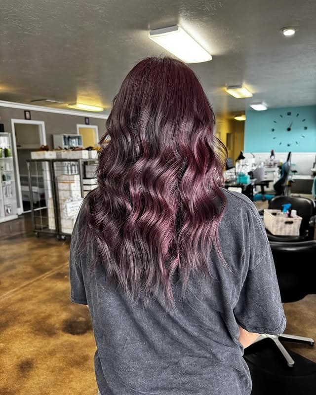 3. Smoky Plum Balayage Curls - Dark Red Hair Color