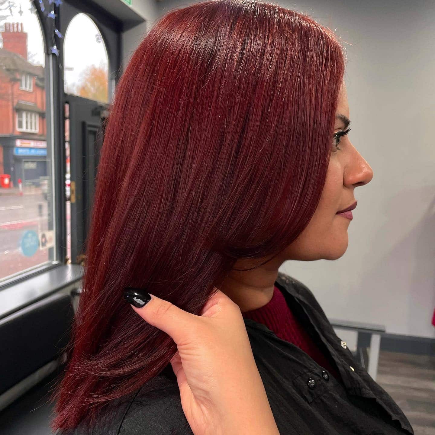 13. Polished Crimson Sleek Layers - Dark Red Hair Color