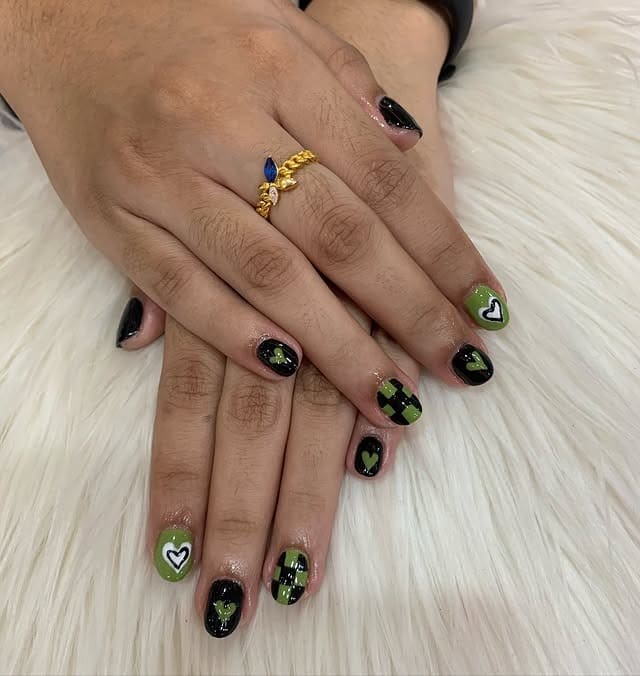 16. Black and Olive Heart Accent Short Nails - cute green nail ideas