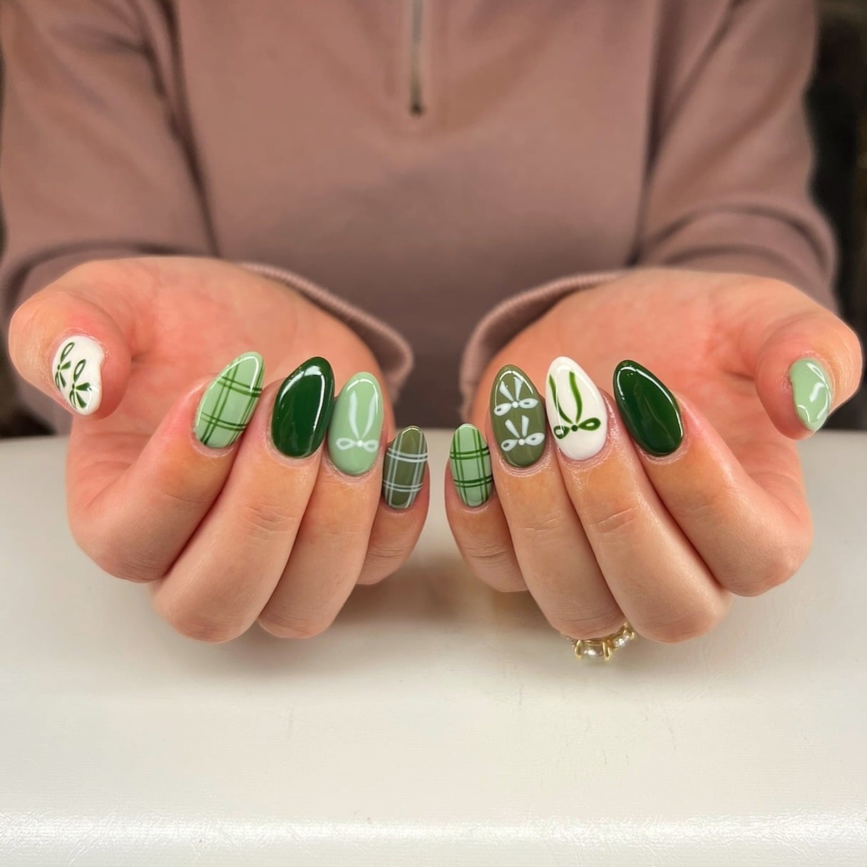 19. Mixed Green Plaid and Botanical Almond Nails - cute green nail ideas