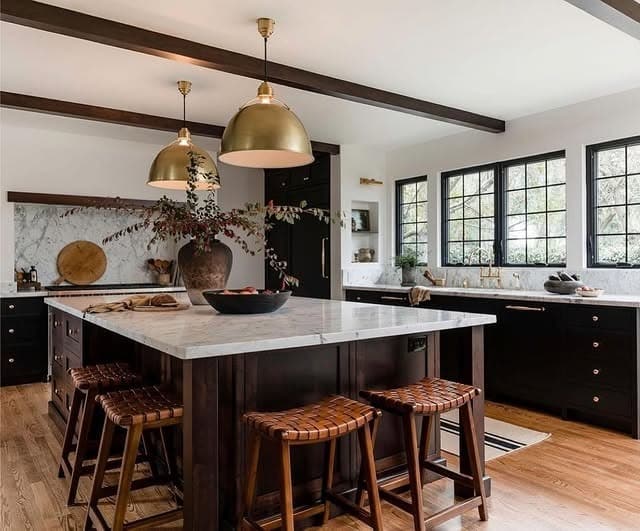 21. Black Shaker Cabinets with Marble Island and Brass Pendants - dark kitchen cabinet ideas