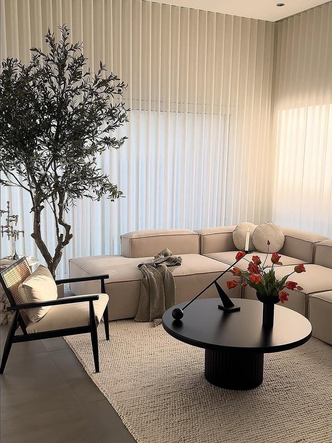 11. Modern Cream Living Room with Black Accents - cozy living room ideas