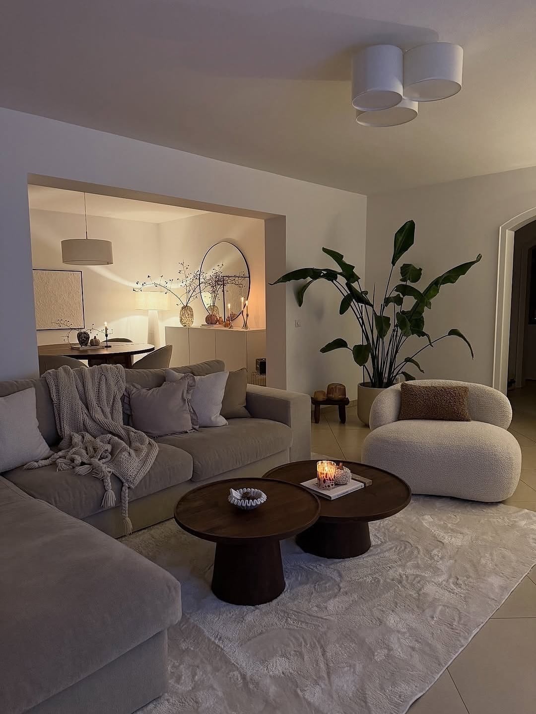 15. Contemporary Taupe Living Room with Sculptural Seating - cozy living room ideas