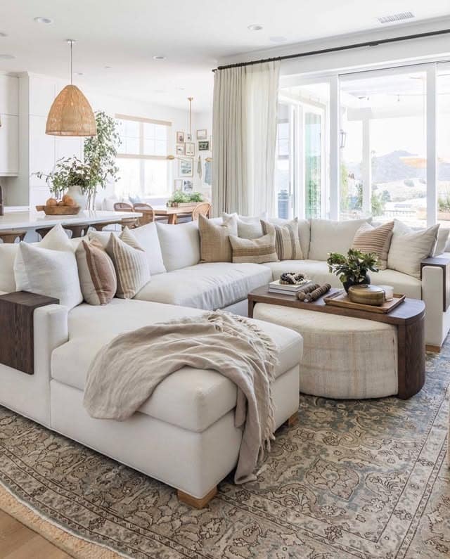 17. Light-Filled Coastal Living Room in Cream and Sand - cozy living room ideas