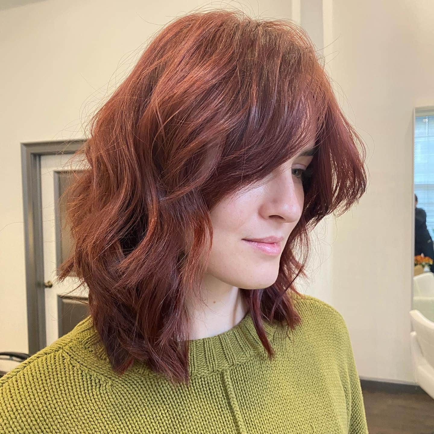 11. Auburn Textured Shag with Side-Swept Fringe - Medium Length Shag Hairstyles