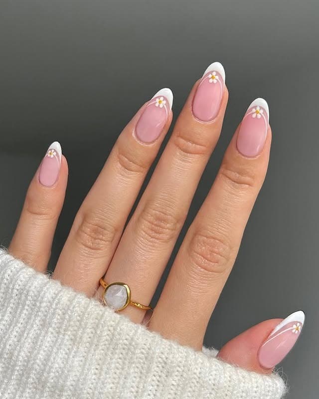 3. Classic Pink French Tips with Daisy Detail - elegant bridal nail ideas
