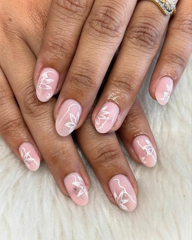 5. Baby Pink Short Oval Nails with White Botanical Art - elegant bridal nail ideas