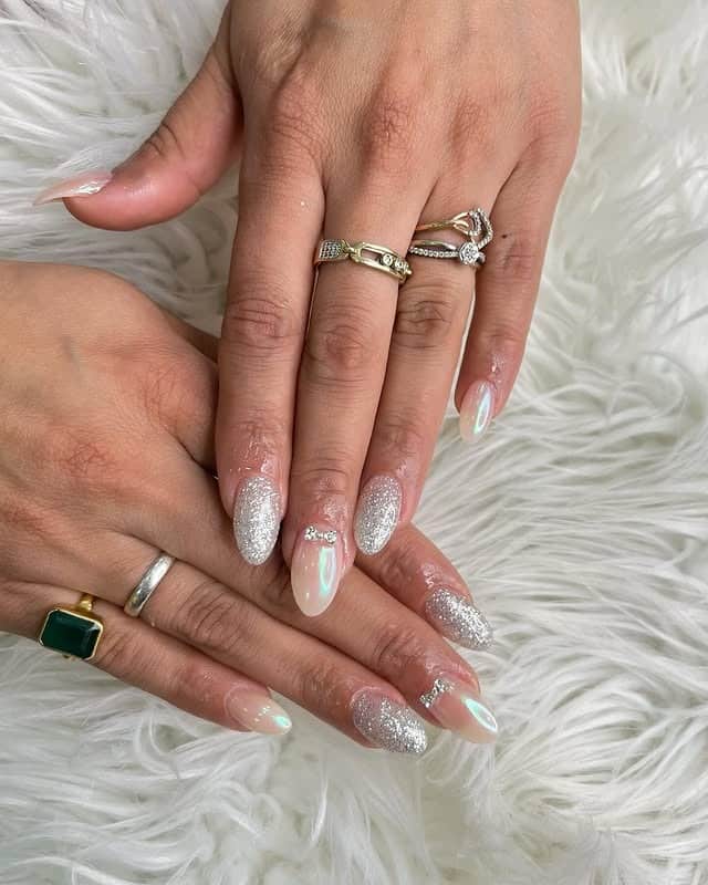 17. Iridescent Pearl Almond Nails with Silver Glitter Accent - elegant bridal nail ideas